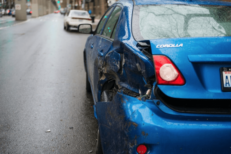 Blue car involved in fender bender Car Accident Lawyer Anaheim, CA